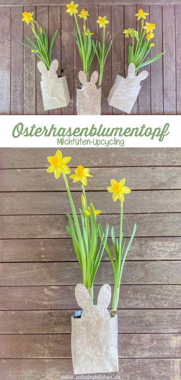 some yellow flowers are in a vase on a wooden table and there is an advertisement for the store