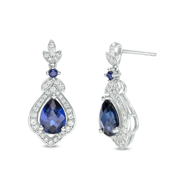 With classic charm, these vintage-inspired drop earrings exude elegance. Crafted in sterling silver, each graceful earring showcases a 7.0 x 5.0mm pear-shaped lab-created bright blue sapphire wrapped in a layered frame of lab-created white sapphire-lined ribbons. The floral drop glistens with created sapphires along petal-like marquise shapes and a petite created sapphire that connects the dangle to the post. Buffed to a brilliant luster, these earrings secure comfortably with friction backs. Classic Teardrop Diamond Earrings For Evening, Classic Pierced Chandelier Earrings For Formal Occasions, Classic Pear-shaped Earrings For Evening, Timeless Pear-shaped Sterling Silver Earrings, Elegant Blue Pear-shaped Diamond Earrings, Classic Pear-shaped Chandelier Earrings For Anniversary, Classic Blue Diamond Drop Earrings, Classic Blue Diamond Earrings For Wedding, Elegant Sapphire Diamond Earrings