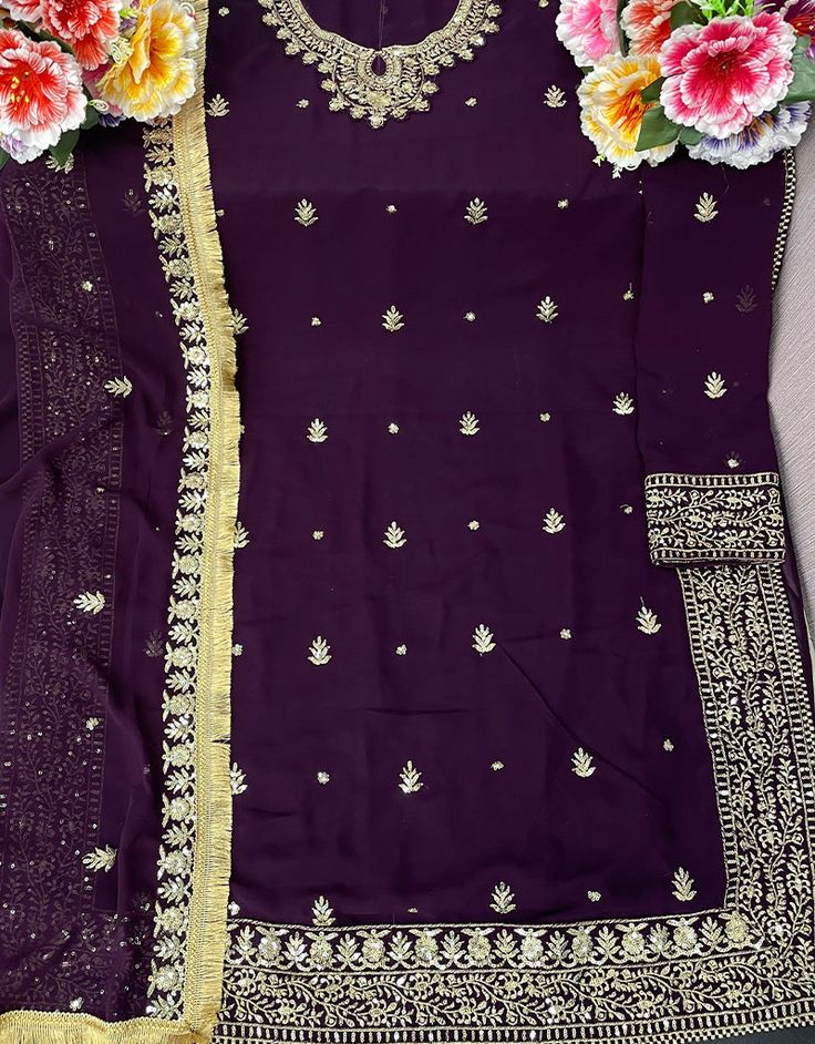 Designer Party Wear Faux Georgett Pakistani Suit Collection Processing Time : 20-25 Working Days Work : Purple Floral Embroidered Georgette Pakistani Suit Fabric:Top : Faux Georgette Bottom : Santoon Dupatta : Faux Georgette Color:Top : Purple Bottom : Purple Dupatta : Purple Note : Purple colored pakistani suit is prettified with thread work as shown which makes it appear classy. This top is made of georgette fabric which is accompanied with santoon bottom, santoon lining and Georgette dupatta. Fitted Embroidered Pant Set For Party, Embroidered Fitted Pant Set For Party, Bollywood Style Pant Set For Party, Festive Embroidered Long Sleeve Pant Set, Festive Long Sleeve Embroidered Pant Set, Bollywood Pant Set With Dabka Work For Party, Festive Party Pant Set With Dabka Work, Embellished Long Sleeve Unstitched Party Suit, Traditional Semi-stitched Pant Set For Party