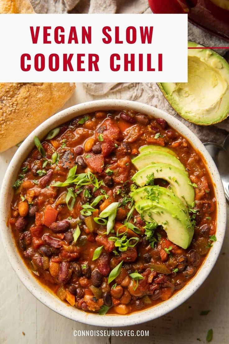 vegan slow cooker chili in a bowl with avocado on the side