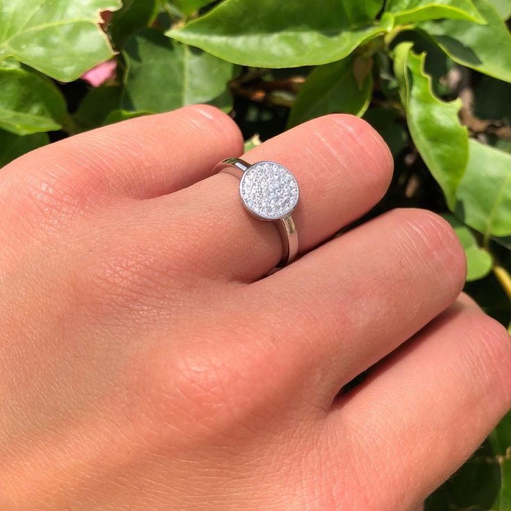 "Item Specifications: ☉ Metal Type: Sterling Silver. ☉ Metal Stamp or Hallmark: .925 ☉ Metal Purity: 92.5% Sterling. ☉ Gemstone: Simulated Cubic Zirconia ☉ Gemstone Creation Method: Simulated ☉ Face Measurements From South To North: 9mm(0.35\") ☉ Approximate Weight: 2.2g ☉ Band Width: 2mm Custom orders welcome!" Anniversary Silver Halo Ring With Pave Setting, Silver Halo Ring With Pave Setting For Anniversary, Sterling Silver Diamond Ring With Pave Setting, Cubic Zirconia Cluster Ring With Pave Setting, Sterling Silver Round Cut Diamond Ring With Pave Setting, Silver Halo Ring With Pave Setting, Silver Halo Ring With Pave Setting And Round Cut, Sterling Silver Promise Ring With Round Stone, Sterling Silver Promise Rings With Pave Setting