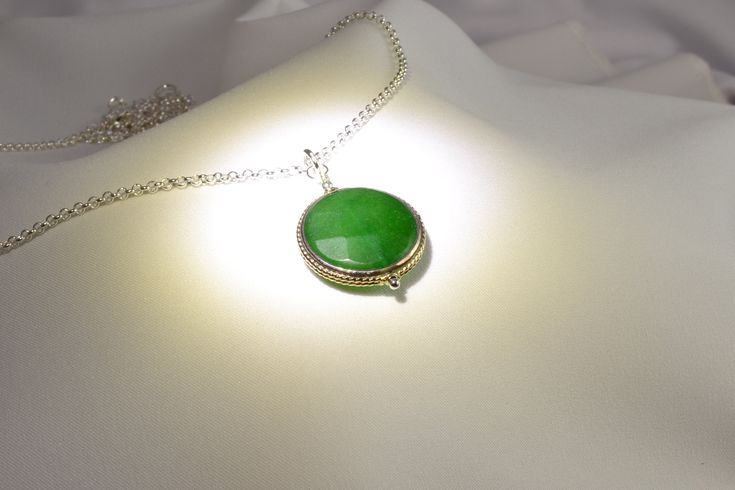 "This handcrafted Nepalese, two-sided, 22mm faceted, genuine green jade pendant hangs on a 26-inch rhodium cable chain with a lobster clasp. This unique piece makes a memorable green gemstone jewelry gift for her. NOTE: This listing is for one necklace with one pendant, but you can choose to purchase just the pendant without the chain (see the drop down menu). The \"Pendant - No Chain\" option includes the pendant with a bail/top loop and no chain. NOTE: Our Nepal pendants are exquisite, but unl Green Crystal Necklaces With Gemstone Beads As Gifts, Bohemian Green Onyx Beaded Necklaces As Gift, Green Crystal Necklace With Gemstone Beads As A Gift, Handmade Necklaces With Round Beads For May Birthstone, Handmade Necklaces With May Birthstone Round Beads, Handmade May Birthstone Necklaces With Round Beads, Green Jade Beaded Necklaces As Gift, Jade Beaded Pendant Necklaces For Gifts, Green Gemstone Beaded Necklaces As Gift