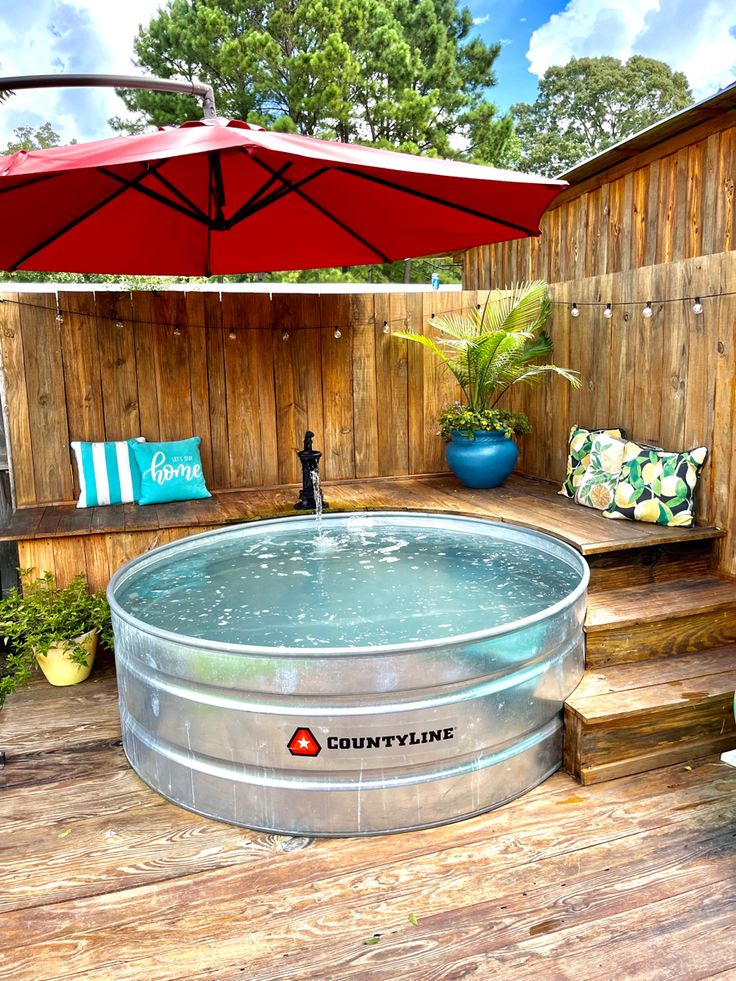 a hot tub sitting on top of a wooden deck