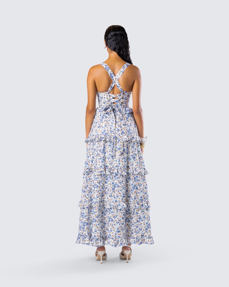 The dress that will have everyone begging to be your summer fling 🥰 Made from plain weave woven fabric and complete with a fit & flare style with tiered ruffles for the perfect flirty and floral look ��💙 Casual Tiered Mini Dress For Garden Party, Flowy Tiered Skirt Floral Dress For Garden Party, Flowy Floral Dress With Tiered Skirt For Garden Party, Summer Tiered Tie Back Dress, Spring Garden Party Ruffle Dress With Ruffled Straps, Spring Cotton Dress With Ruffled Skirt, Tiered Tie Back Sundress, Tiered Tie-back Sundress, Floral Print Tiered Sundress