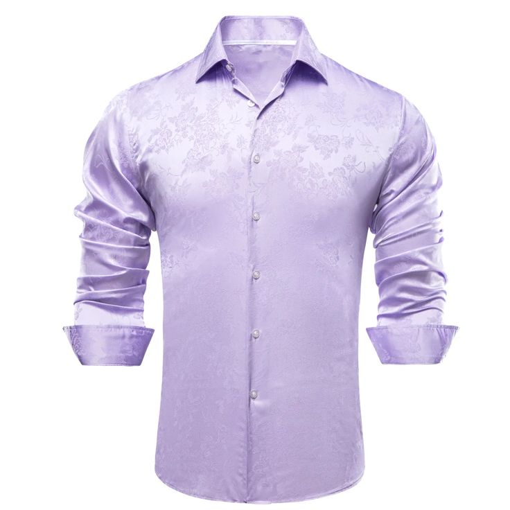 The Lavender Floral Silk Dress Shirt is a luxurious and elegant addition to any wardrobe. Made from premium quality silk, it feels soft and comfortable against the skin and drapes beautifully, providing a sleek and sophisticated look. The purple color of this shirt gives it a unique and trendy look, making it perfect for both formal and casual occasions. The button-up front and traditional point collar give it a timeless feel and a modern look. This shirt is versatile and can be paired with a va Silk Dress Shirt, Floral Silk Dress, Stretch Satin Fabric, Jacquard Shirt, Silk Shirt Dress, Lavender Floral, Silk Floral Dress, Satin Shirt, Lilac Purple