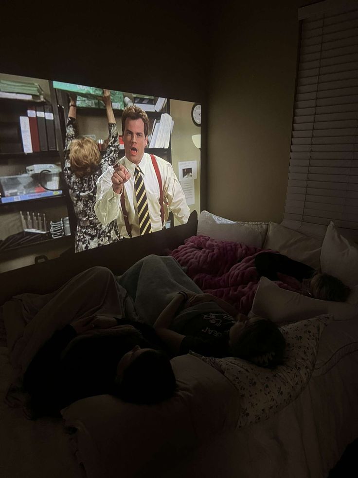 A group of friends watching a movie on a projector Bedroom With Movie Projector, Watching Movies At Home Aesthetic, Watching Movies With Friends Aesthetic, Watching Movie Projector Aesthetic, Movie Night In Aesthetic, Movie Set Up At Home, Projector Tv Bedroom, Watching Film At Home Aesthetic, Dorm Room Projector