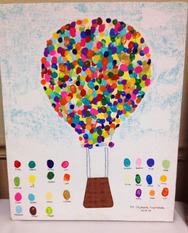 a colorful hot air balloon painted on white paper with colored dots in the shape of a heart