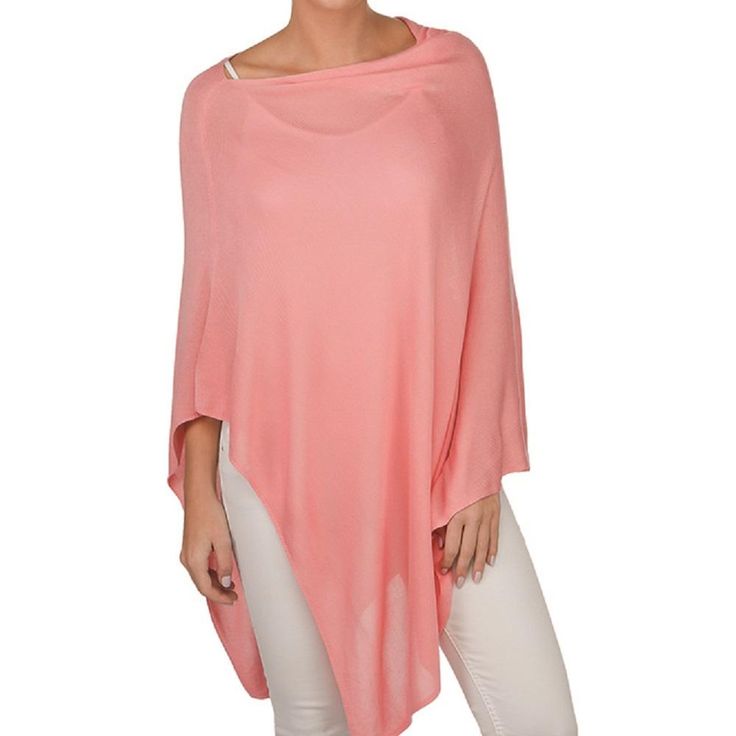 Best Seller! Our favorite poncho is this must have Bamboo topper. Its lightweight with a sweeping asymmetrical hem and the perfect drape. This versatile layering piece is perfect to wear anytime time, Take advantage of bamboo's natural UV protection property. Dress it up or down to fit any occasion. Model is 5' 8" and wears a size 4 Details & Care: One Size 100% Bamboo. Fine gauge knit 26''L X 31''W 40''L from shoulder point to bottom Wash cold, Dry Flat Poncho Cape, Outlet Store, Fall Style, Asymmetrical Hem, Layering Pieces, Ponchos, Asymmetric Hem, Small Businesses, Orange Color