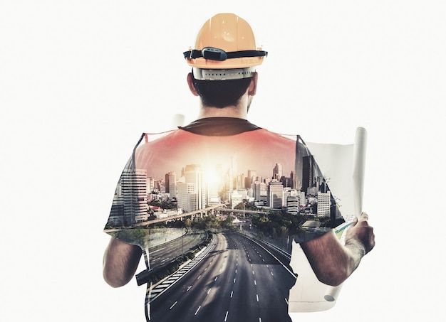 a man in hardhat holding up an image of a city