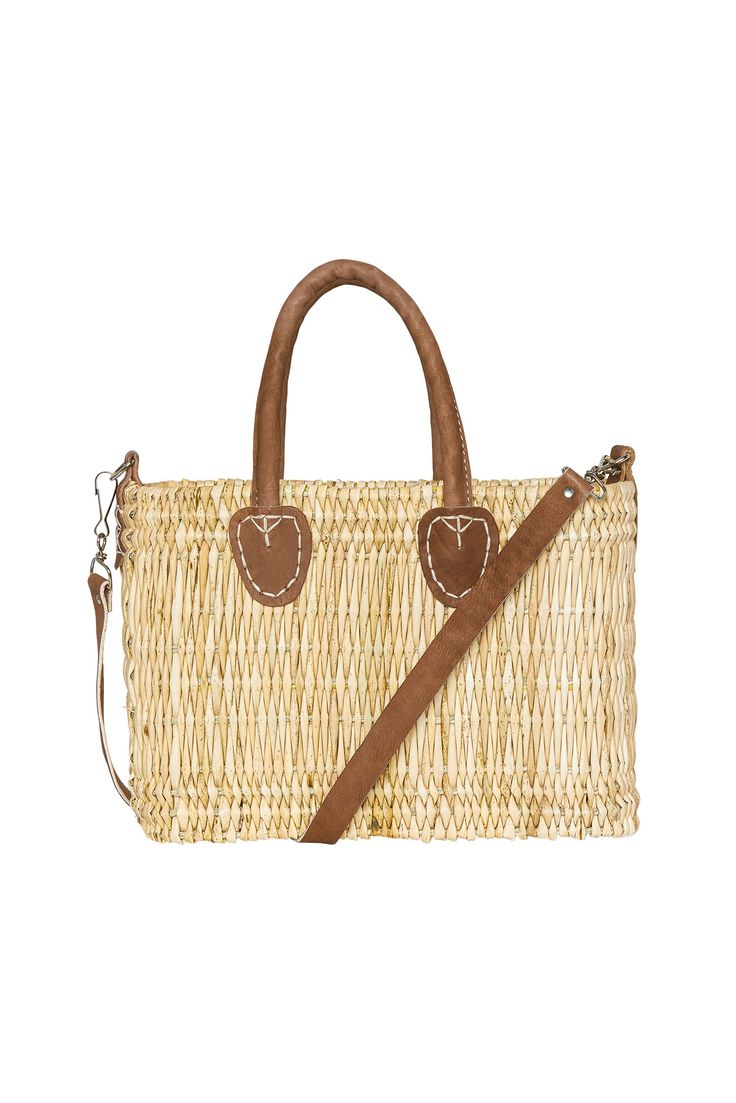 The cutest little bag Inspired by the breathtaking aesthetic of Lake Como, our structured, hand-woven beach bag is accentuated with leather handles, a leather shoulder strap, and gold hardware. Perfect for all beach needs, it can go from sand to supper, and everything in between: shopping, traveling, you name it! We particularly love this bag for its added adjustable leather shoulder strap.Features:Structured mini straw bag Hand-woven seagrass constructionAdjustable shoulder strapArtisan leather Beach Needs, Jean Bucket Hat, Natasha Oakley, Monday Swimwear, Cover Beachwear, Lake Como, Woven Bag, Leather Handles, Name It