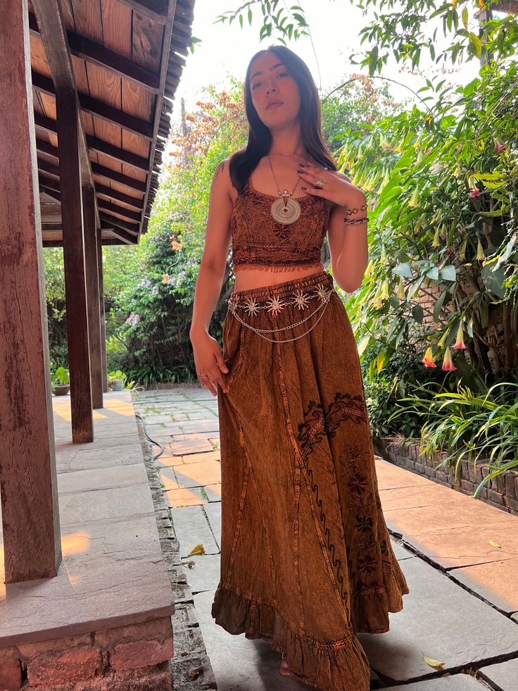 Introducing our Pari Vintage Vibe Brown Top & Maxi Skirt, perfect for embracing boho hippie vibes! This stunning set includes a maxi skirt with a pleated border that adds a touch of elegance and offers a chic, comfortable fit. Crafted with comfort yet elegant fashion in mind, this ensemble is ideal for creating enchanting looks. Choose between two top variations: a halter top or a smocked top, both designed to complement the flowing silhouette of the skirt. Available in various sizes, this set c Festival Flowy Tiered Maxi Dress, Bohemian Tiered Skirt Maxi Dress, Bohemian Wide Leg Maxi Dress For Summer, Bohemian Flowy Tiered Maxi Skirt, Bohemian Wide Cut Summer Maxi Dress, Flowy Boho Print Hippie Skirt, Bohemian Tiered Skirt Maxi Dress For Festival, Hippie Flowy Maxi Skirt With Boho Print, Hippie Boho Print Flowy Maxi Skirt