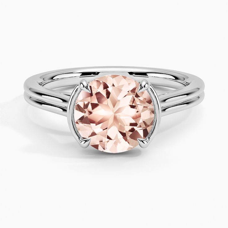 Morganite Jade Trau Alure Solitaire Engagement Ring - 18K White Gold. Cathedral shoulders, a semi-bezel, and claw prongs create a classic solitaire silhouette in this modern yet timeless high polish ring. Crafted so other bands rest perfectly flush on the top or bottom, this design is made to be worn as part of a chic stack. 
 
 Our perfect fit engagement rings are carefully designed to sit flush against a variety of wedding rings for a seamless look with no gaps. 
 
 Jade Trau adds a signature Elegant Morganite Ring With Center Stone, Elegant Morganite Wedding Ring With Brilliant Cut, Elegant Morganite Wedding Jewelry With Center Stone, Elegant Morganite Ring For Formal Occasions, Elegant Morganite Rings For Formal Events, Classic Morganite Wedding Ring With Brilliant Cut, Elegant Morganite Wedding Ring With Prong Setting, Elegant Morganite Cushion Cut Rings, Elegant Round Cut Morganite Jewelry