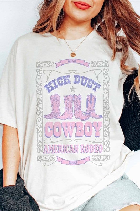 Introducing the Kick Dust Cowboy American Rodeo Graphic Tee, a design that captures the spirit of cowboy culture and the excitement of American rodeos. This tee features a bold graphic that embodies the action and energy of rodeo events. With its dynamic imagery, the Kick Dust Cowboy American Rodeo Graphic Tee celebrates the thrill of riding, roping, and the rugged lifestyle of cowboys in the American West. Whether you're a rodeo enthusiast, a fan of cowboy traditions, or simply seeking a tee th Spring Graphic Print T-shirt For Rodeo, Western Style Relaxed Fit Graphic T-shirt, Western Style Relaxed Fit T-shirt With Graphic Print, White Western T-shirt For Rodeo, Retro Fall Rodeo T-shirt, Western Style Cotton T-shirt For Rodeo, Western Style Relaxed Fit T-shirt With Screen Print, Trendy Relaxed Fit T-shirt For Rodeo, White Graphic Tee For Rodeo