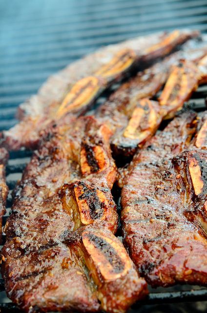 steaks are cooking on the grill and being grilled