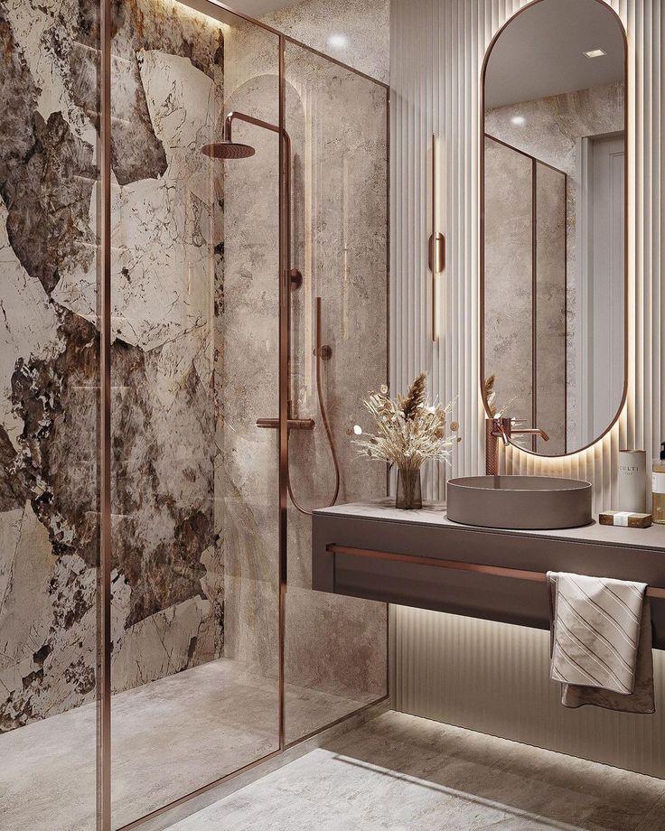 a modern bathroom with marble walls and flooring