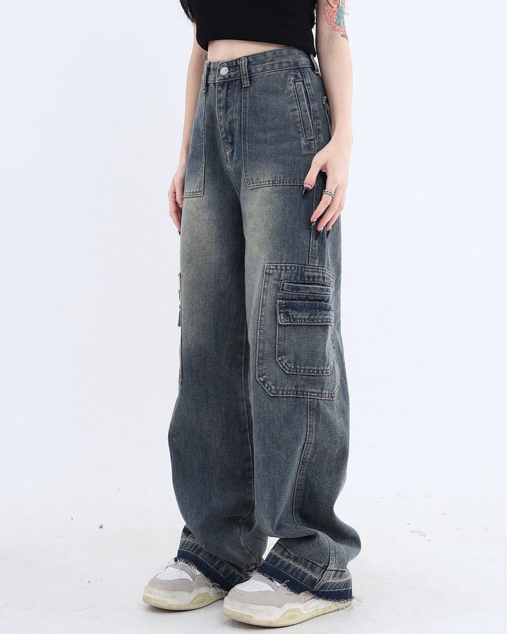 These baggy wide leg jeans have a washed denim construction, cargo pockets on the front and back, and a zip-fly closure Size: • S: Waist: 64cm/ 25.2 in, Hips: 92cm/ 36.2 in, Length: 101cm/ 39.8 in• M: Waist: 68cm/ 26.8 in, Hips: 96cm/ 37.8 in, Length: 102cm/ 40.2 in• L: Waist: 72cm/ 28.3 in, Hips: 100cm/ 39.4 in, Length: 103cm/ 40.6 in• XL: Waist: 76cm/ 29.9 in, Hips: 104cm/ 40.9 in, Length: 104cm/ 40.9 in• XXL: Waist: 82cm/ 32.3 in, Hips: 108cm/ 42.5 in, Length: 105cm/ 41.3 inMaterial: Denim Y2k Style Baggy Flare Jeans With Pockets, Y2k Style Wide Leg Flare Jeans With Pockets, Y2k Wide Leg Flare Jeans With Pockets, Y2k Style Blue Cargo Jeans With Cargo Pockets, Blue Y2k Cargo Jeans With Cargo Pockets, Y2k Dark Wash Denim Cargo Jeans, Blue Y2k Cargo Jeans With Pockets, Y2k Style Denim Jeans With Pockets, Y2k Denim Jeans With Pockets