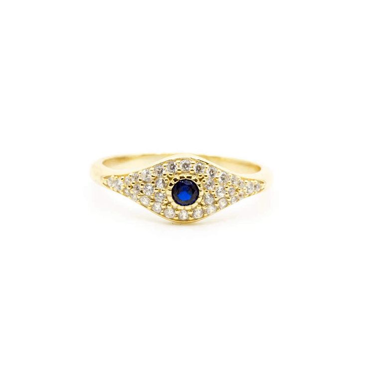 Luck never looked so good. This Evil Eye ring is a symbol of luck and protection, and needs to be featured in your daily ring stack! 14k gold plated sterling silver Clear crystals with a sapphire center stone Gold Sapphire Jewelry For Promise, Gold Sapphire Ring With Center Stone For Promise, Gold Sapphire Spiritual Promise Ring, Spiritual Gold Sapphire Promise Ring, Gold Sapphire Crystal Ring, Spiritual Gold Birthstone Promise Ring, Gold Sapphire Jewelry With Center Stone, Spiritual Gold Crystal Ring In Sterling Silver, Gold Sterling Silver Sapphire Promise Ring