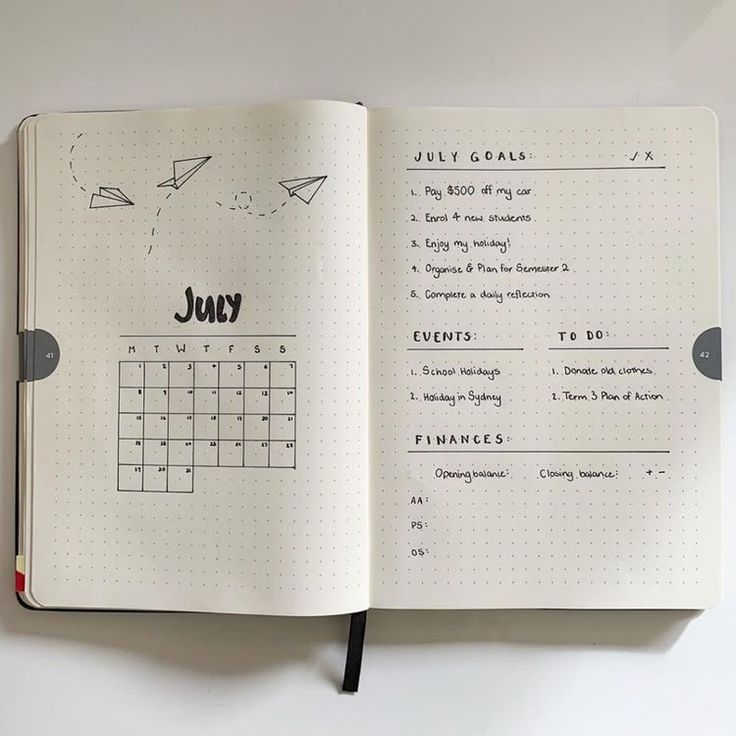 an open notebook with a calendar on it