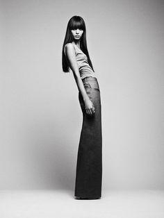 black and white photograph of woman in long dress