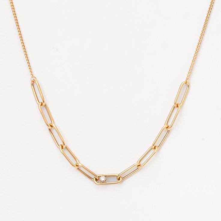 For fans of paperclip link chains, this new necklace from Zoe Chicco is a gorgeous piece to add to your collection. With a gleaming prong-set, round white diamond stationed just off the center, this necklace brings a luxe feel to every look. Wear this beauty on its own or pair it with contrasting chains for the perfect stack. Chain adjusts between 16" and 18". 14 karat yellow gold with round white diamond totaling 0.10 carat.