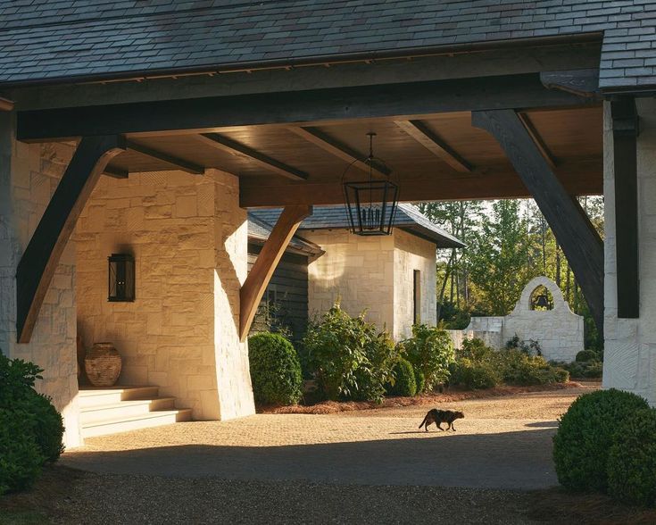 a dog is walking in front of a house