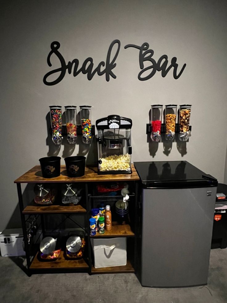 the snack bar is organized and ready for customers to enjoy their favorite snacks on the night