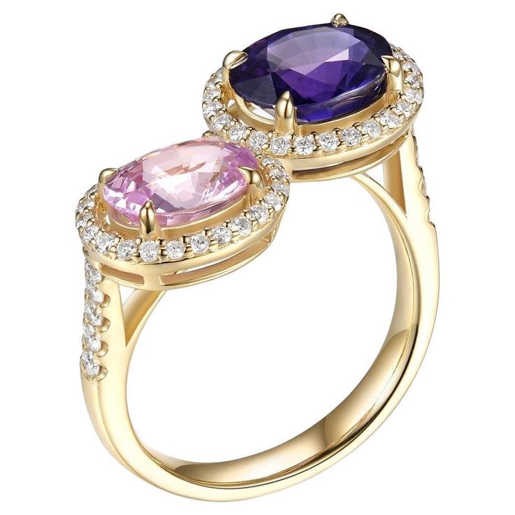 Delight in this exquisite "Toi et Moi" ring, a timeless symbol of love translating to "you and me." Carefully crafted in 18-karat yellow gold, it showcases a purple sapphire juxtaposed with a pink sapphire in a classic bypass design. Combined, these fancy sapphires weigh an impressive 3.87 carats. Complementing the vibrant stones is a halo design adorned with 0.38 carats of hand-set diamonds, elevating the ring's elegance. This "Toi et Moi" design not only captures the essence of two souls becoming one but also stands as a testament to enduring love and style. Embrace this ring as a romantic gift or a chic personal statement. Purple Sapphire 2.49 carat Pink Sapphire 1.38 carat Pave brilliant cut diamonds 0.38 carat Fancy Sapphire, Timeless Symbol, Symbol Of Love, Garnet And Gold, Halo Design, Purple Sapphire, Personal Statement, Stone Design, Romantic Gift