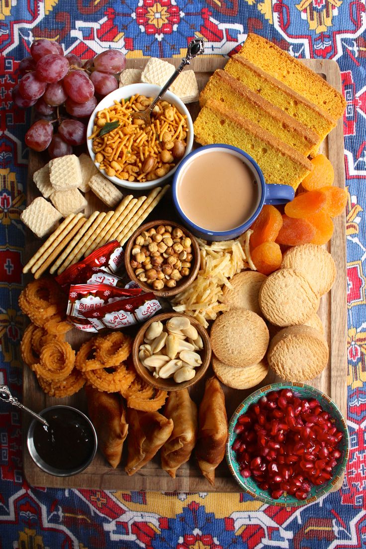 an assortment of snacks and crackers on a tray