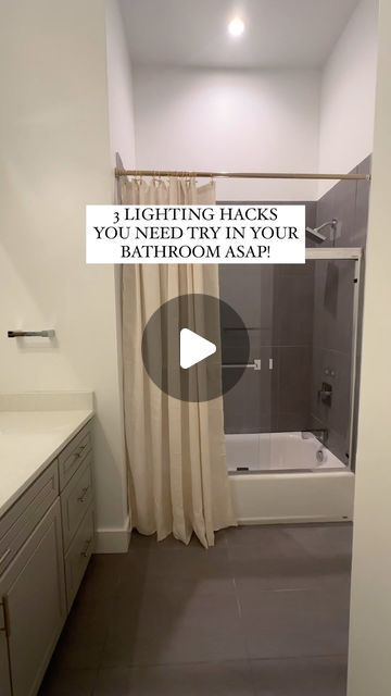 a bathroom with a bathtub, shower and sink in the background text reads 3 lighting hacks for your bathroom asap?