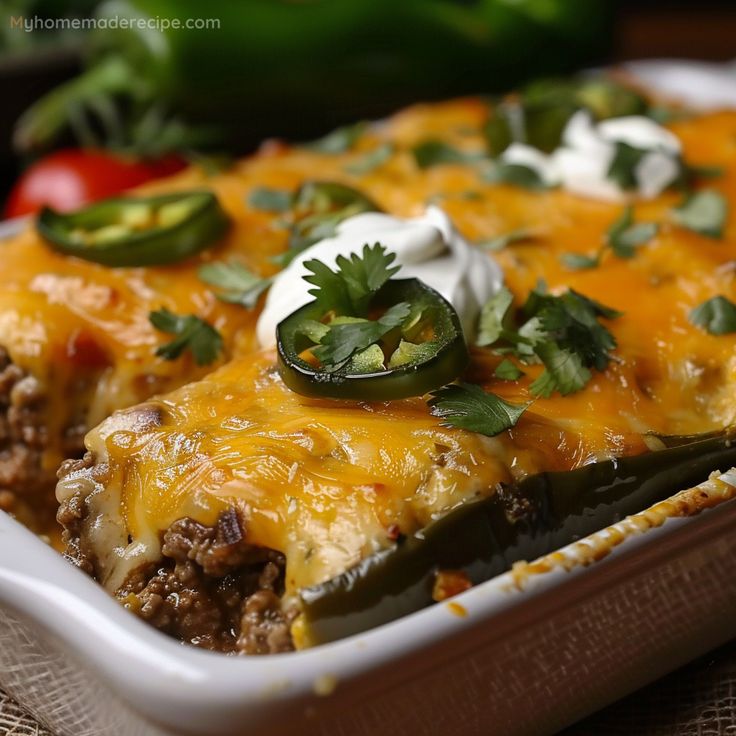 a casserole dish with meat, cheese and vegetables