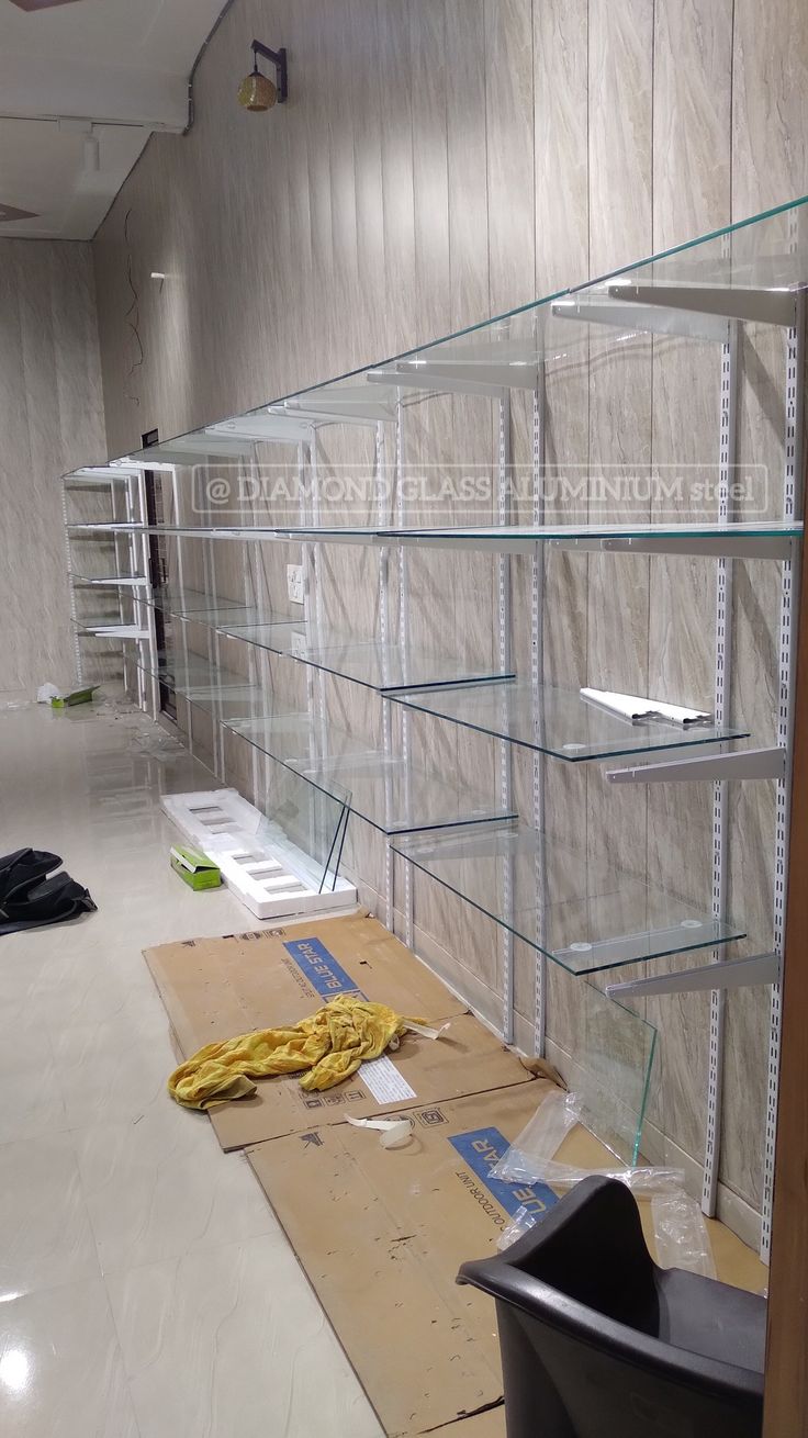 Glass shelf rock for 8mm glass full info Glass Self Design Wall, Glass Racks Shelves For Shop, Racks Design Display For Shop, Glass Racks Shelves, Racks Design Display, Display Rack Design Retail Stores, Shop Rack Design, Glass Shelf Ideas, Decorate Empty Wall