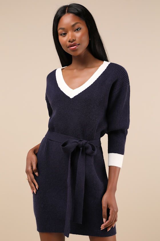 Stay cute all season long in the Lulus Cuddly Forecast Navy Long Sleeve Belted Sweater Mini Dress! Soft and chunky sweater knit shapes this effortless dress that has long sleeves with drop shoulders and a V-neckline. Relaxed-fit bodice has a removable sash belt, atop a figure-skimming mini skirt. White-toned ribbed knit accents the neckline and cuffs. Fit: This garment fits true to size. Length: Mid-thigh. Size medium measures 33" from shoulder to hem. Bust: Great for any cup size. Waist: Loosel Fall Sweater Dress, Sweater Mini Dress, Belted Sweater, Blue Dress Casual, Sash Belt, Mini Sweater Dress, Skirt White, Mini Dress Casual, Chunky Sweater