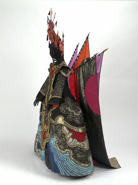 a woman dressed in an elaborately designed costume