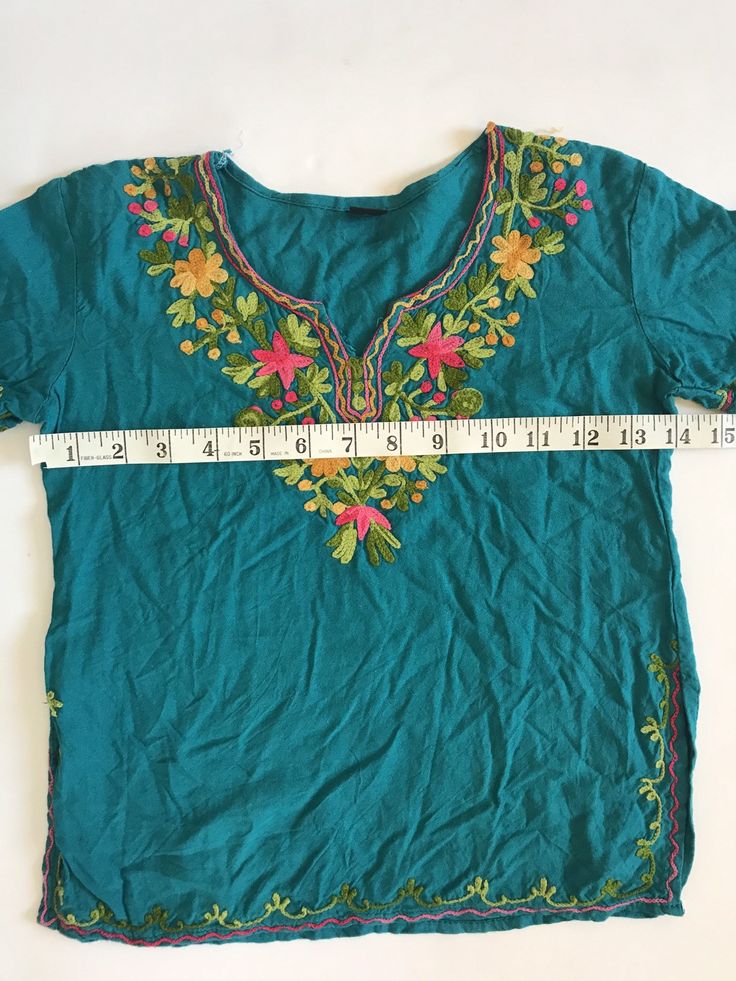 This top is in great condition and it's super soft cotton with stunning floral embroidery. It's best fitted for a 4-6 year old with measurements provided in the photos for an accurate fit. It's the perfect little hippie top to tuck into ol' Levis or bloomers ✌🏽 (5) Green Embroidered Top For Summer, Spring Bohemian Embroidered Tunic Top, Bohemian Spring Embroidered Tunic Top, Summer Green Tops With Intricate Embroidery, Green Tops With Intricate Embroidery For Summer, Summer Casual Peasant Top With Intricate Embroidery, Spring Tunic Top With Intricate Embroidery, Summer Bohemian Tops With Embroidered Neckline, Bohemian Embroidered Cotton V-neck Top