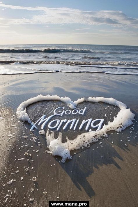 the word good morning written in the sand at the beach