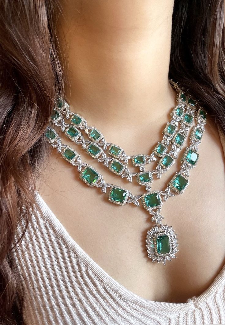 Add a touch of glamour and sophistication with this high quality necklace set in beautiful Teal green stones. The stones in this set bling and look close to the real thing. This set is sure to make heads turn!  It features an adjustable necklace and a pair of earrings. It can be paired perfectly with both ethnic and western outfits.  In case of any queries, please feel free to reach out. Happy shopping! Item includes Necklace and earrings Green Stones, Wedding Bridal Jewellery, Wedding Jewellery Necklace, Wedding Necklaces, Silver Spring, American Diamond, Adjustable Necklace, Gold Jewellery Design, Diamond Set