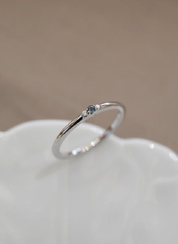 14k white gold | 1.7mm round birth stone accented band Olive Avenue Jewelry, Baguette Diamond Rings, Blue Zircon, Engraved Items, Jewelry Companies, Baguette Diamond, Perfect Ring, High Quality Jewelry, Diamond Bands