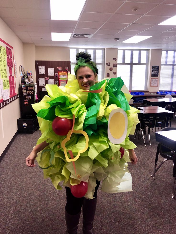 a woman is dressed up like a fruit costume