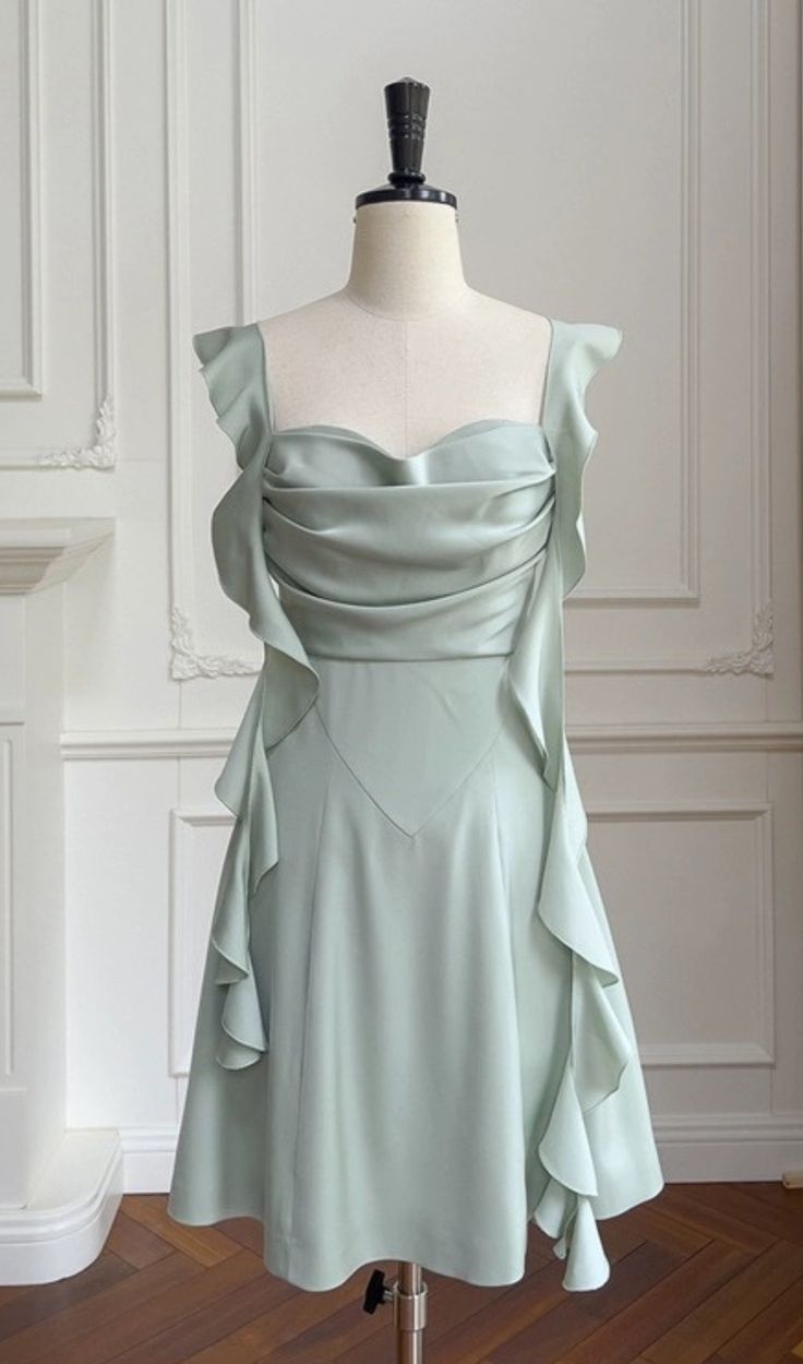 Elevate your allure with our Sage Green Satin Mini Dress. Crafted to captivate, its satin fabric drapes luxuriously, while the subtle hue exudes sophistication. Perfect for any occasion, it radiates timeless elegance with a modern twist. Cute Mint Green Dress, Gaun Hijau Sage, Pre-draped Green Evening Dress, Elegant Green Mini Dress With Ruched Bodice, Pre-draped Satin Mini Dress For Cocktail, Elegant Green A-line Satin Dress, Green Pleated Bodice Satin Dress, Elegant Green Ruched Mini Dress, Green Satin Dress With Pleated Bodice