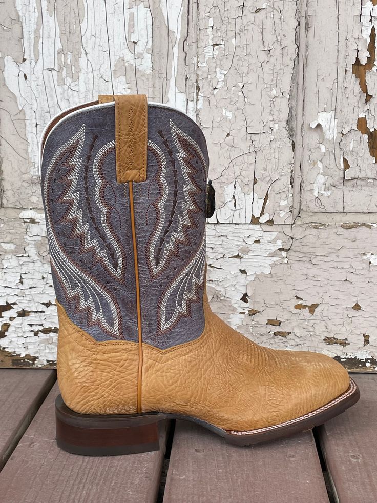 Crafted from the best bison leather, the Dugan boot in camel from Dan Post Cowboy Certified is in a league of its own. Along with its eye-catching stitching, the Dugan features a broad square toe, stockman heel, Soft Strike Removable Orthotic and a bone crusher runner outsole. Shaft -Leather Height - 11" Circumference - 12" Heel - 1" Stockman Lining - Leather Toe - Square Outsole - Rubber Comfort System -Removable Antibacterial & Antifungal Soft Strike Orthotic Round Toe Cowboy Boots, Lizard Design, Square Toe Cowboy Boots, Bison Leather, Western Store, Dan Post, Cowgirl Western, Western Hats, Store Hours