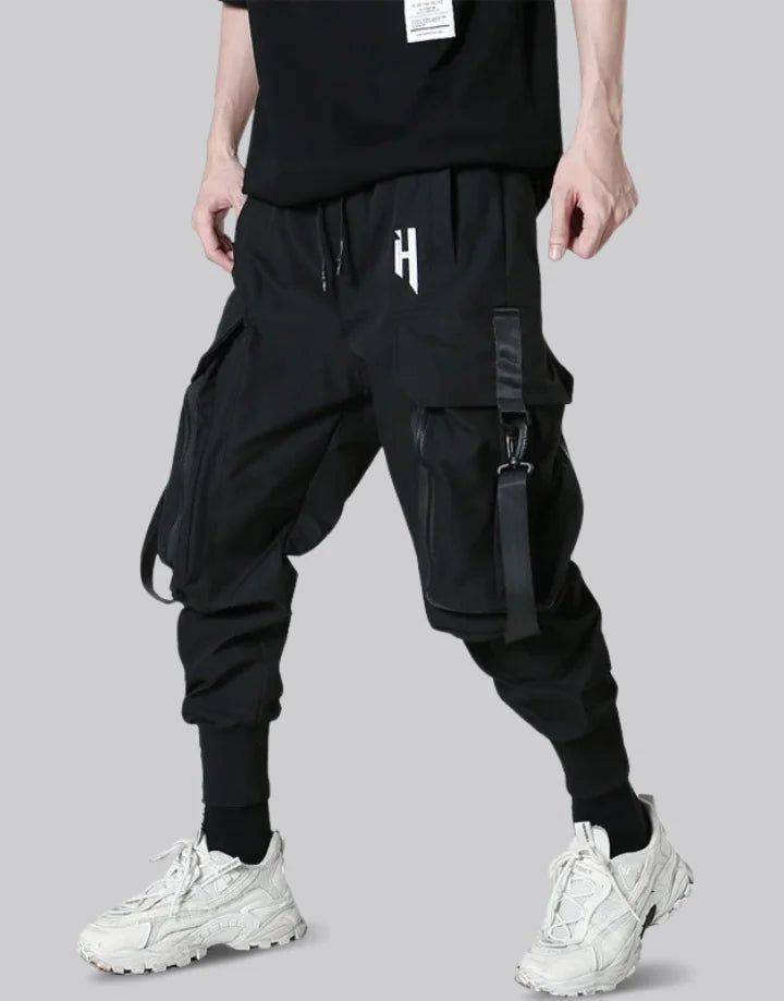 Cyberpunk Joggers Techwear Parachute Pants For Outdoor Activities, Techwear Baggy Parachute Pants For Outdoor, Baggy Techwear Parachute Pants For Outdoor, Techwear Joggers With Side Pockets, Black Techwear Cargo Pants For Sports, Techwear Style Cargo Pants For Streetwear, Cyberpunk Black Pants For Outdoor, Black Cyberpunk Pants For Outdoor, Techwear Baggy Sweatpants For Streetwear