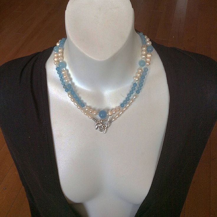 This combo style spiritual necklace handmade with round Aquamarine and Pearl beads. It will be a nice gift for sophisticated fashion and/or jewelry lover.  Our pictures show how we could wear this Blue and Pearl beautiful combo necklace.  By its metaphysical meaning, Aquamarine increases leadership abilities. Pearl is known as a nature wisdom creature. Each Pearl is unique, it absorbs and holds different inspirational thoughts, and the energy of one bead doesn't blend with the energy of another. All kinds of the natural Pearls balance and heal all chakras. Blue Double Strand Spiritual Necklace, Double Strand Gemstone Pearl Necklace Gift, Double Strand Pearl Necklace With Gemstone For Gift, Double Strand Pearl Necklace Gift, Elegant Custom Gemstone Beads Necklace As Gift, Elegant Custom Necklace With Gemstone Beads For Gift, Multi-strand Pearl Necklace With Natural Stones For Gifts, Gift Multi-strand Pearl Necklace With Natural Stones, Spiritual Multi-strand Necklace With Unique Variations