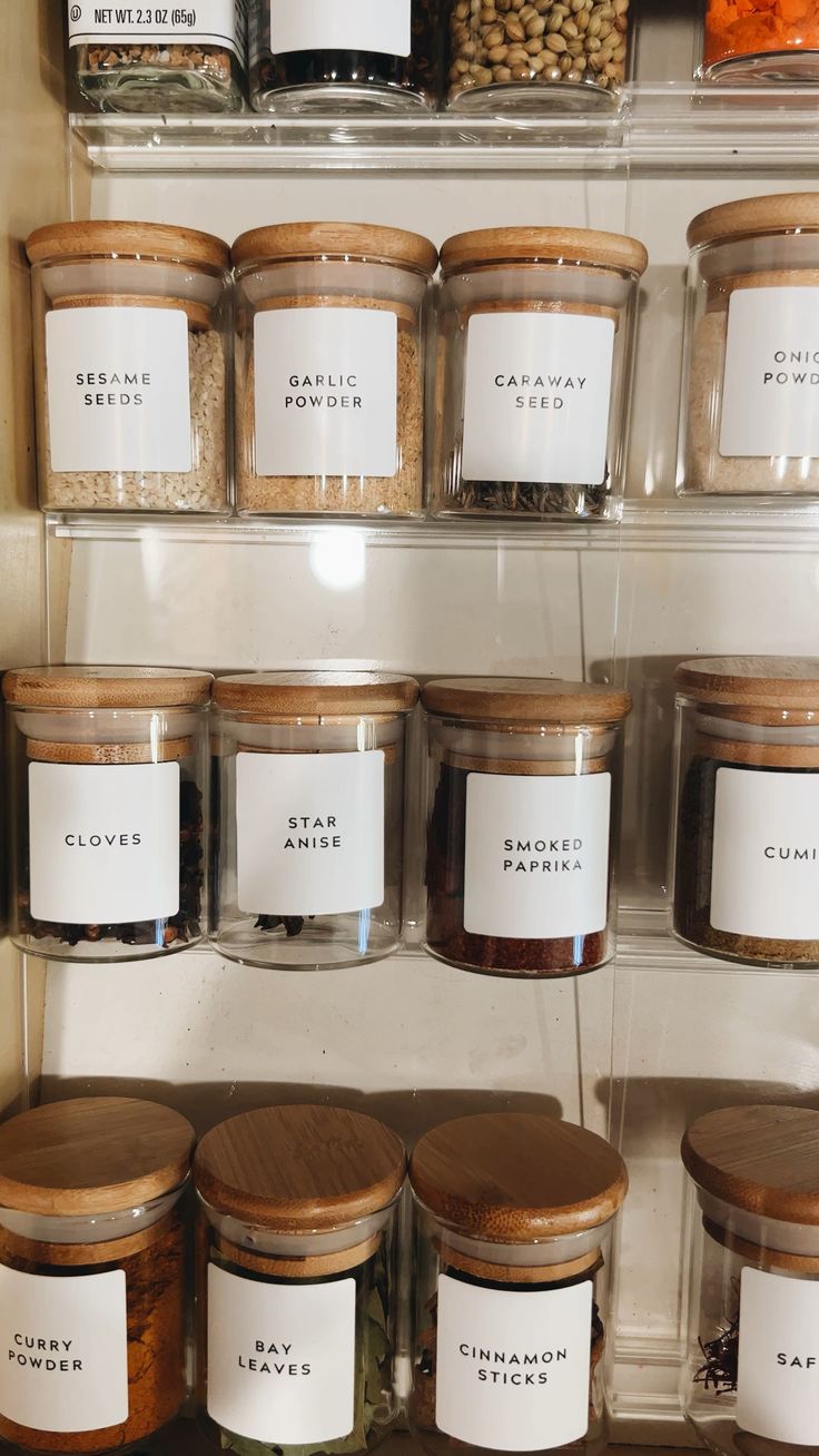 the shelves are filled with jars and spices