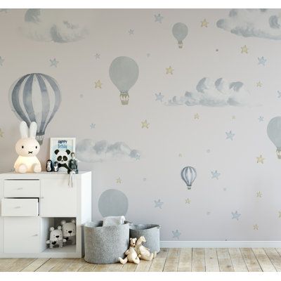 a child's room with a hot air balloon wallpaper