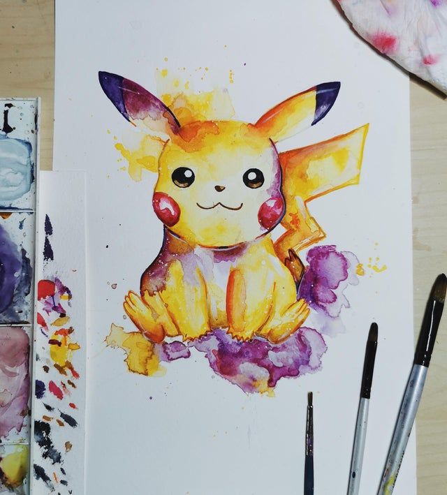 a painting of a pikachu sitting on top of a table next to paintbrushes