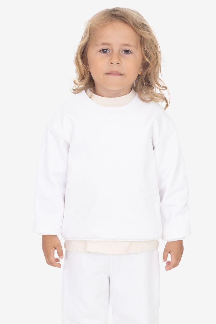 A 14 oz. Heavy Fleece sweatshirt made for kids. Features drop shoulders, long sleeves and a crew neckline. This fleece is very heavy and will provide you with warmth in temperatures as low as 50°F (10°C). These sweatshirts are made in South Central, Los Angeles by expert sewers using premium construction materials and techniques. Made in Los Angeles, Calif. Our experienced sewers earn up to $25 an hour and no less than $17.28; additionally workers have healthcare benefits for less than $15 per w Lace Knitwear, Denim Short Jumpsuit, Made For Kids, Denim Workwear, South Central, Jumpsuit Jacket, Leather Denim, Fleece Sweatshirt, Construction Materials