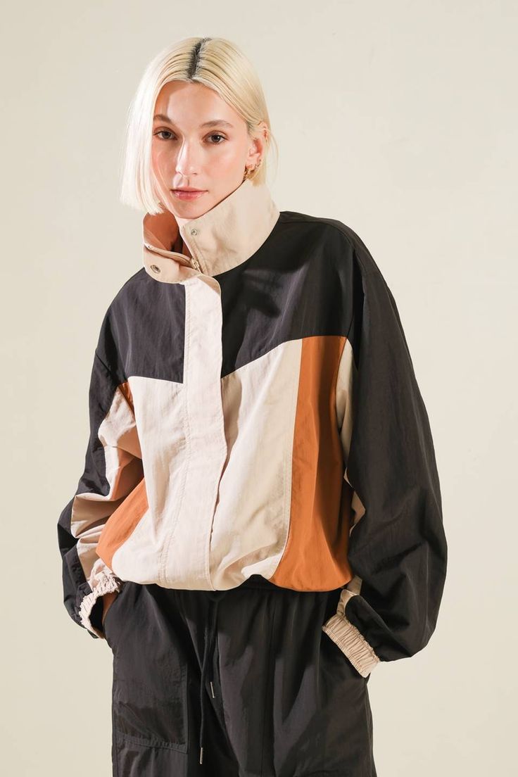 A woven color block windbreaker Details: Self: 100% NylonContrast 1: 100% NylonContrast 2: 100% Nylon Size & Fit - Model is 5`8" And Wearing Size Small- Measurements Taken From Size Small- Approx. Length: 24" Beige Sporty Track Jacket For Fall, Beige Nylon Windbreaker For Winter, Urban Style Windbreaker With Contrast Color For Fall, Spring Windbreaker With Contrast Color And Long Sleeves, Color Block Long Sleeve Track Jacket For Fall, Casual Windbreaker With Contrast Color For Fall, Casual Nylon Outerwear With Contrast Color, Casual Fall Windbreaker With Contrast Color, Fall Color Block Track Jacket With Long Sleeves