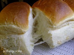 two loaves of bread sitting on top of a cooling rack