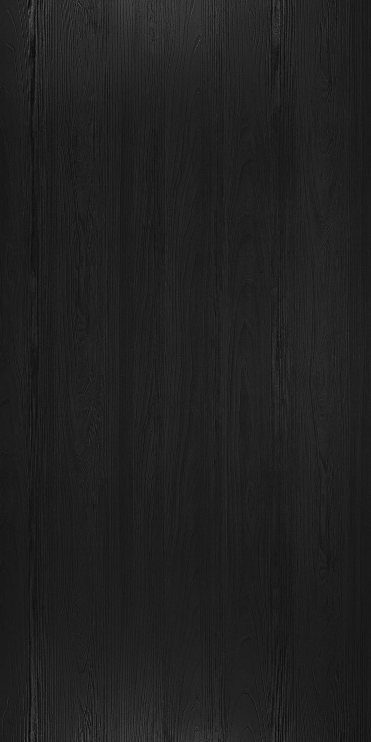 black wood textured background with light coming from the top