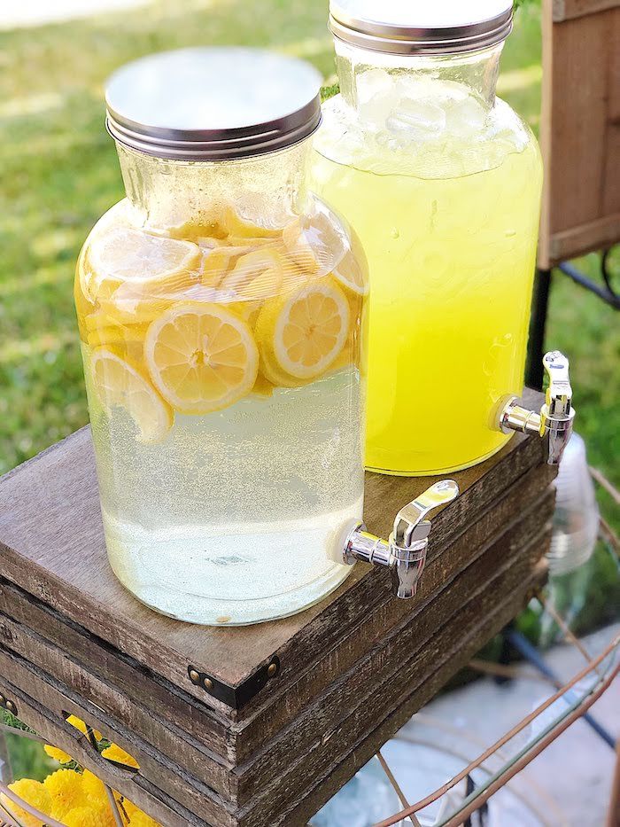 two mason jars filled with lemonade and water